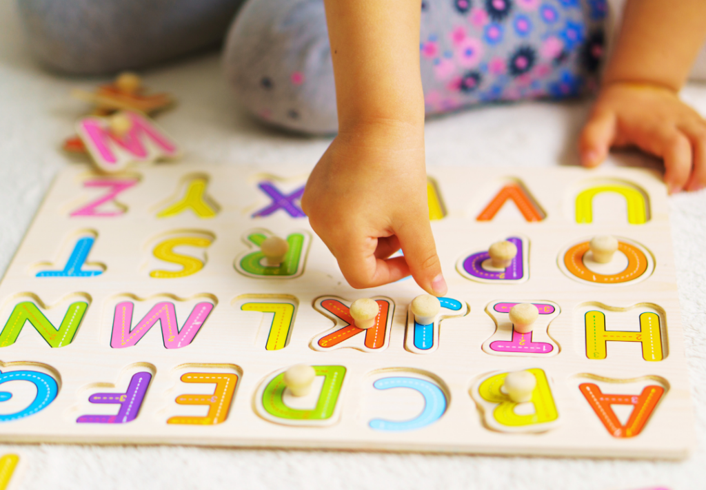 kid doing wooden puzzle