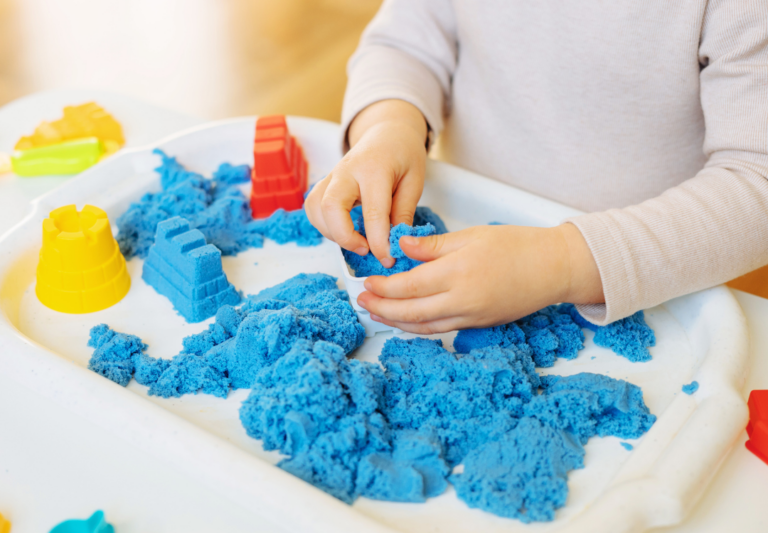 kid playing in a sensory bin